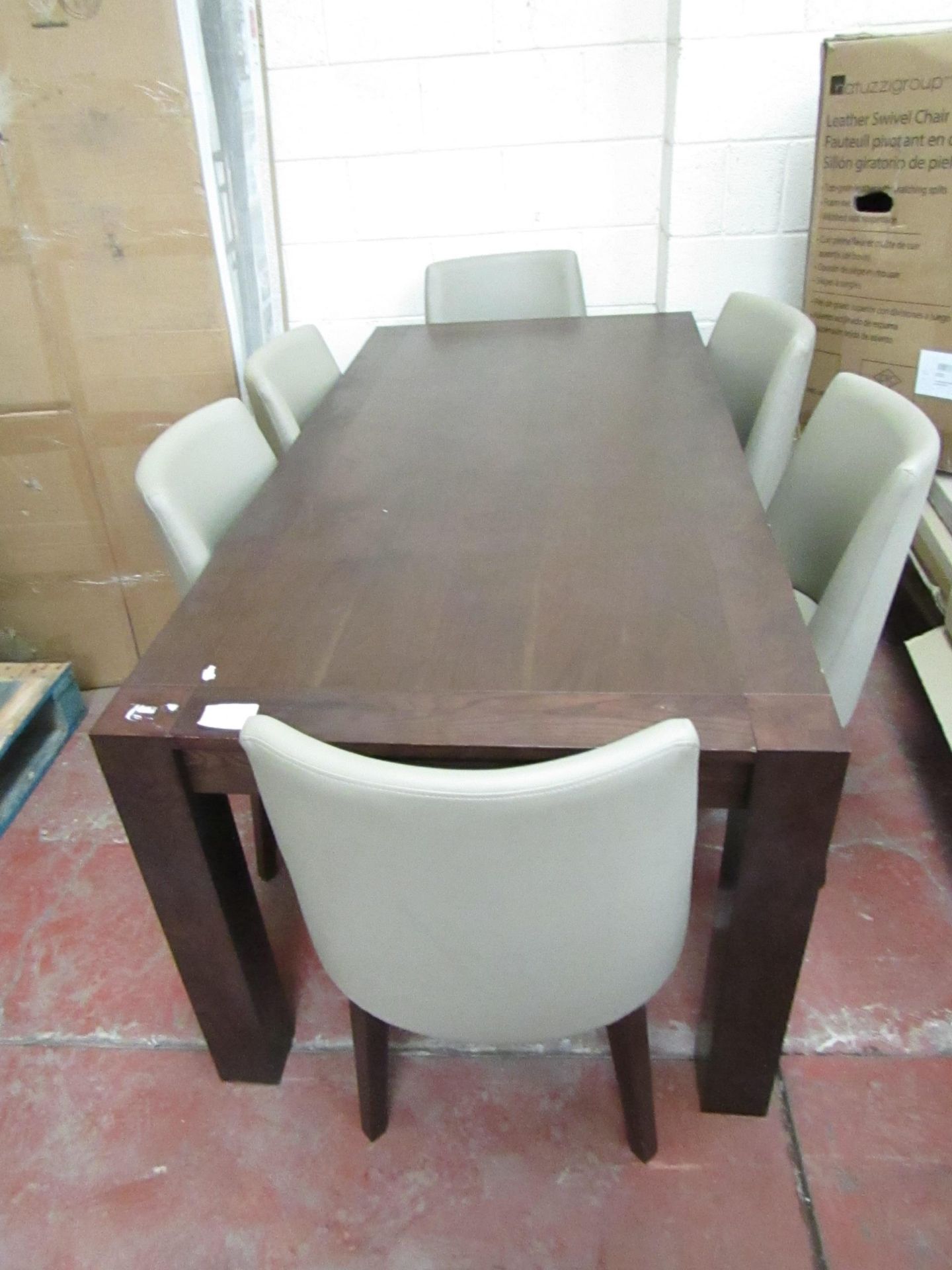 Dining table with 6 Chairs, a few if the chairs have some marks on them and the table has a few