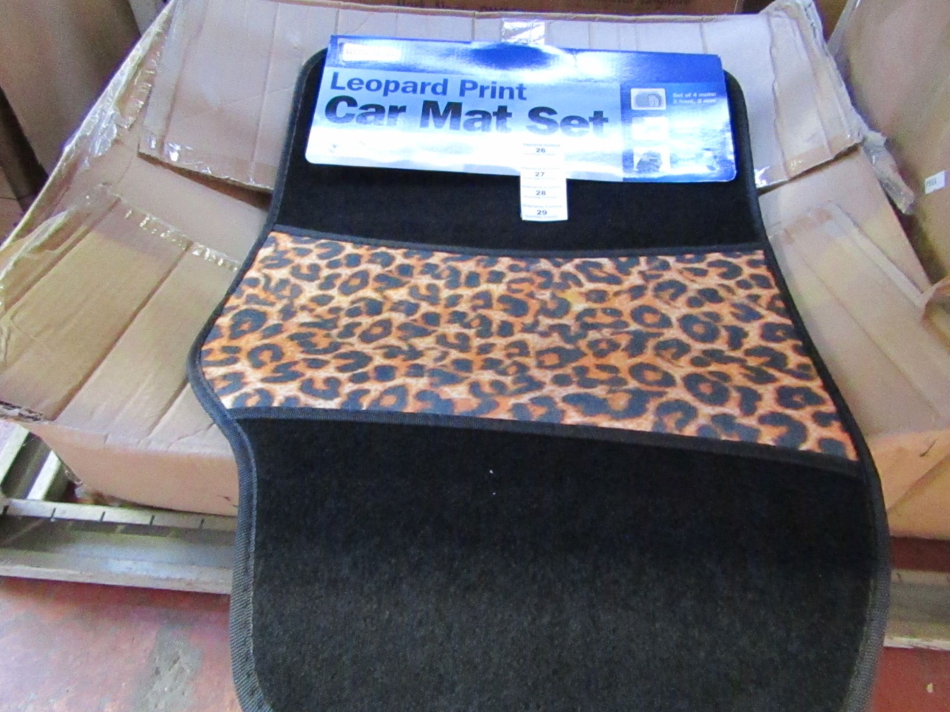 Set of 4 leopard print car mats, new and packaged.