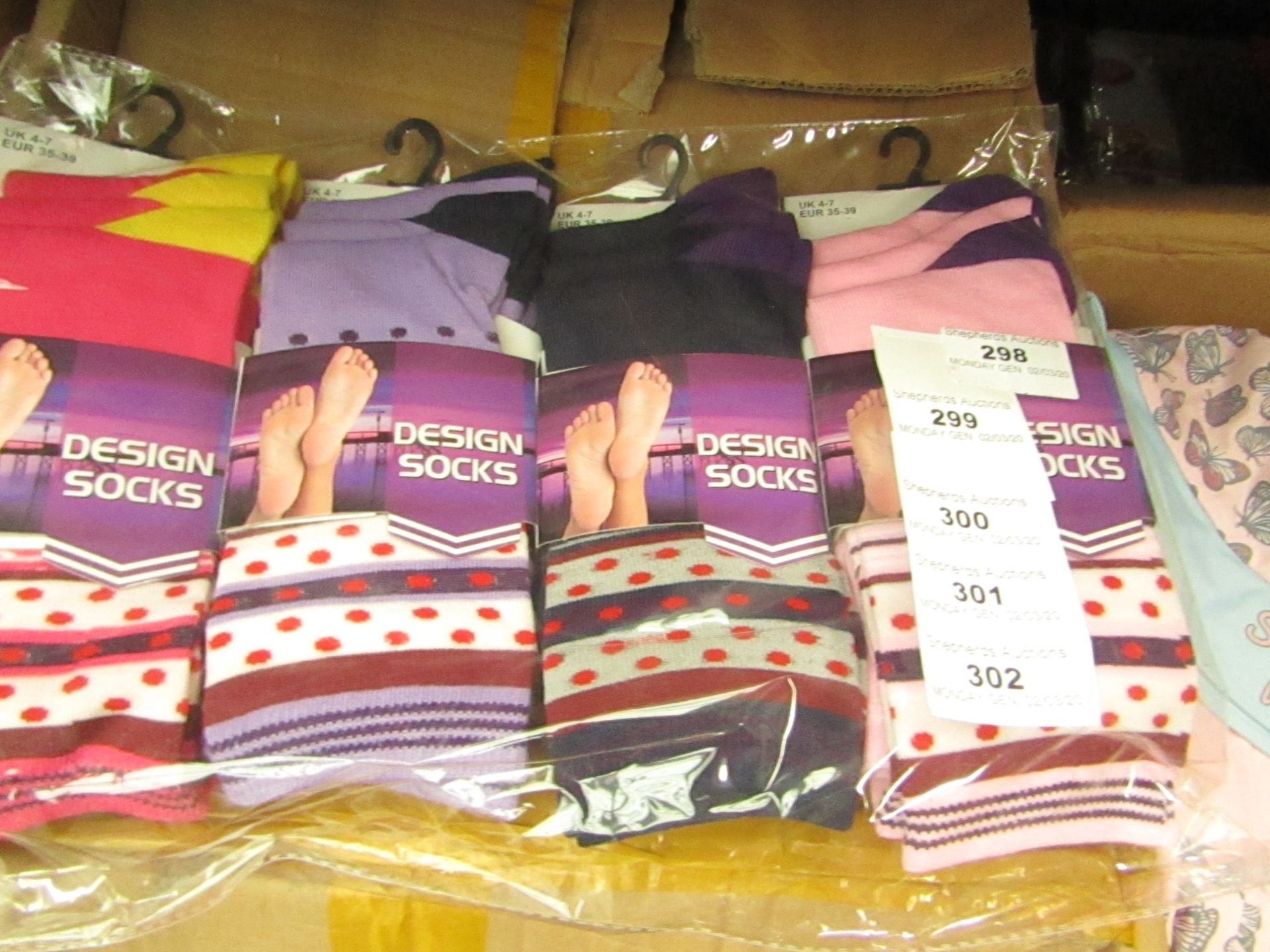 12 Pairs of Ladies Design Socks. Size 4 - 7. New & Packaged