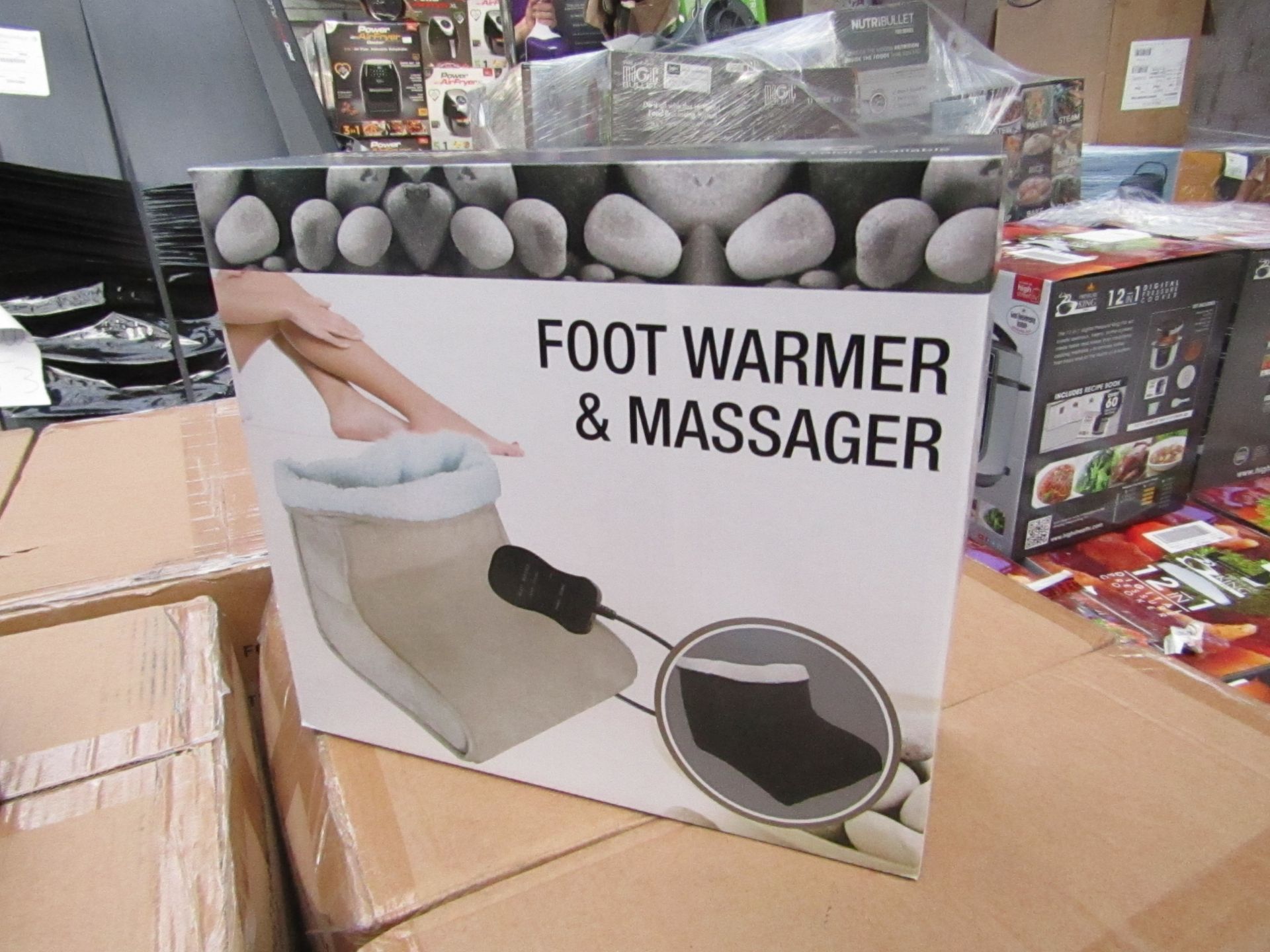 Foot warmer and massager, new and boxed.