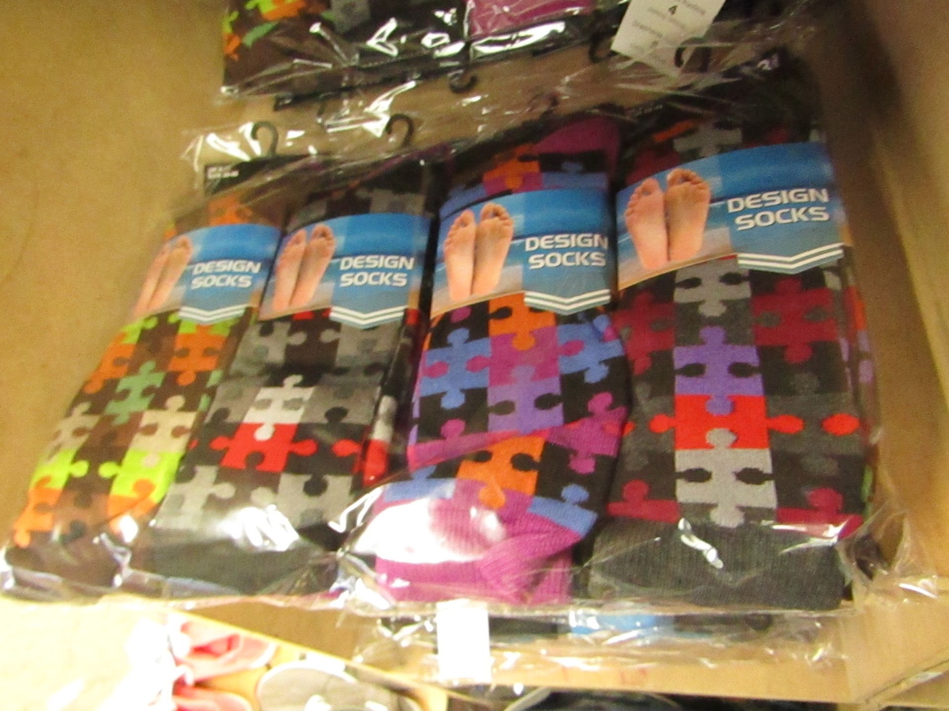 12 X Pairs of Mens Design Socks size 6-11 new in packaging (see image for design)