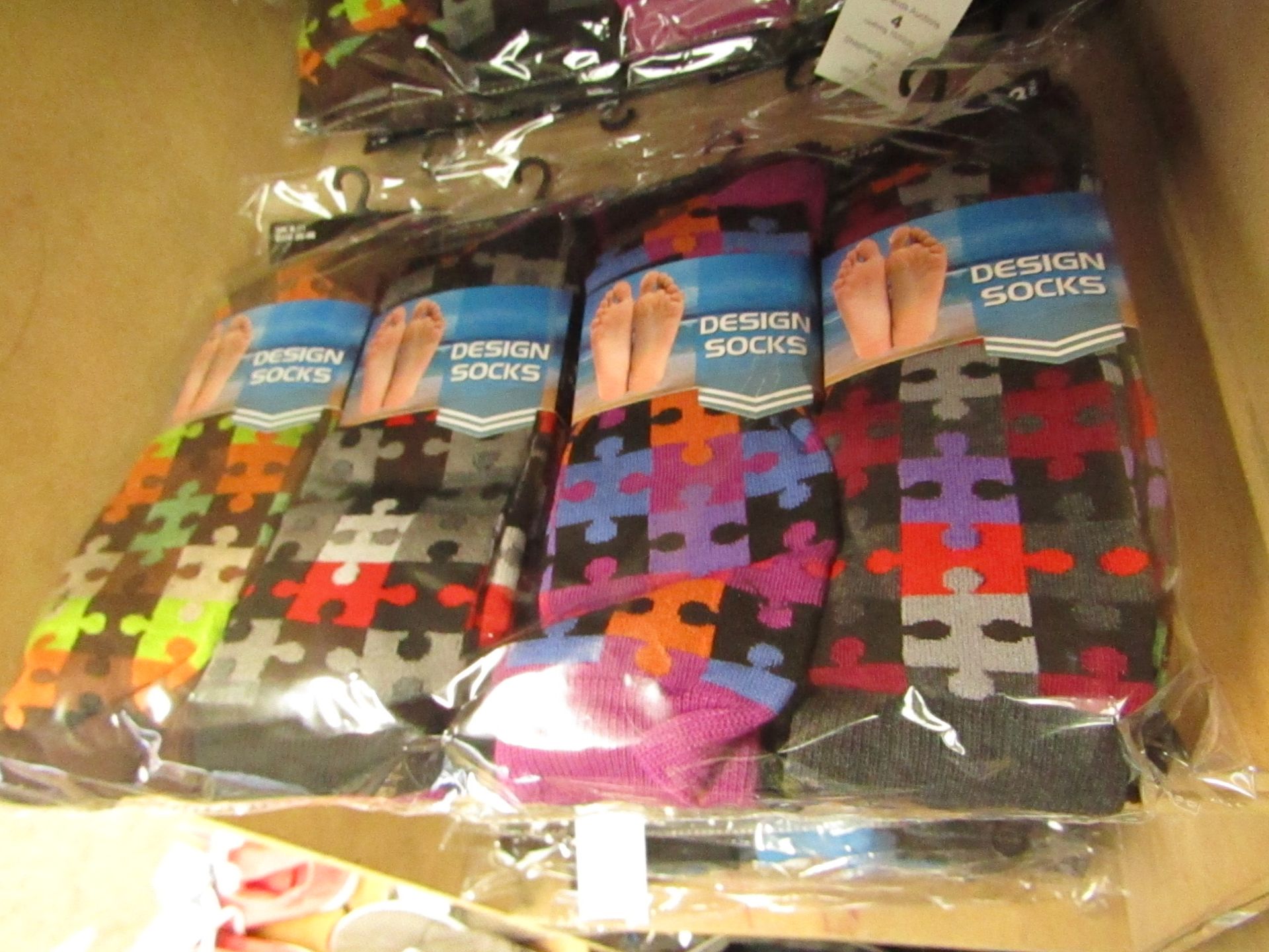 12 X Pairs of Mens Design Socks size 6-11 new in packaging (see image for design)