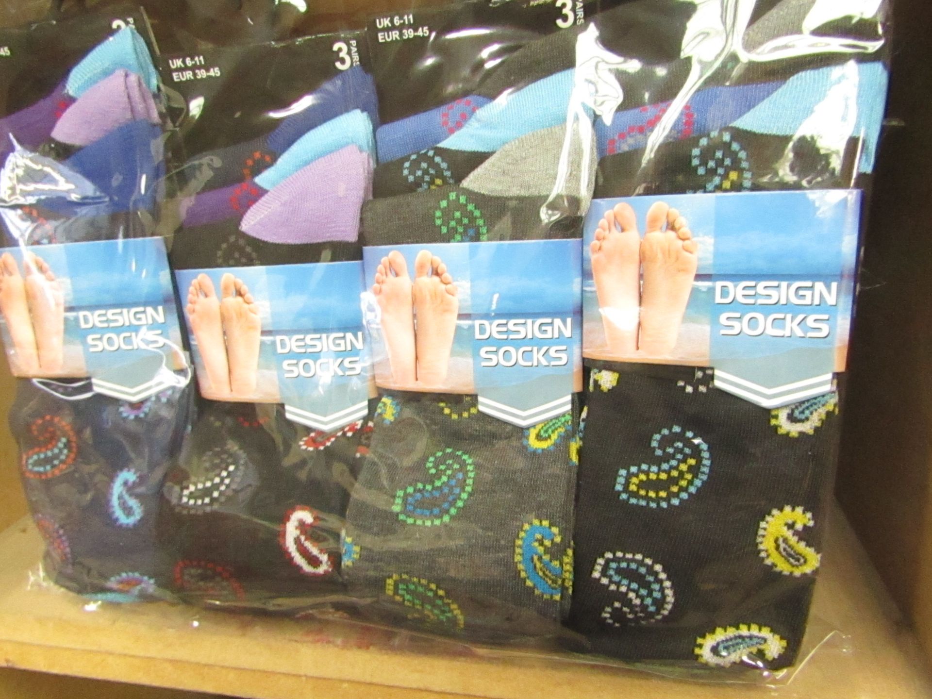 12 X Pairs of Mens Design Socks size 6-11 new in packaging (see image for design)