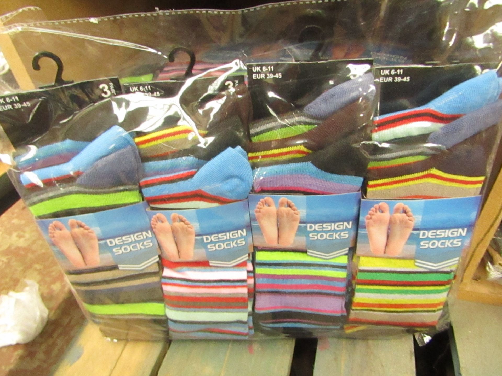 12 X Pairs of Mens Design Socks size 6-11 new in packaging (see image for design)