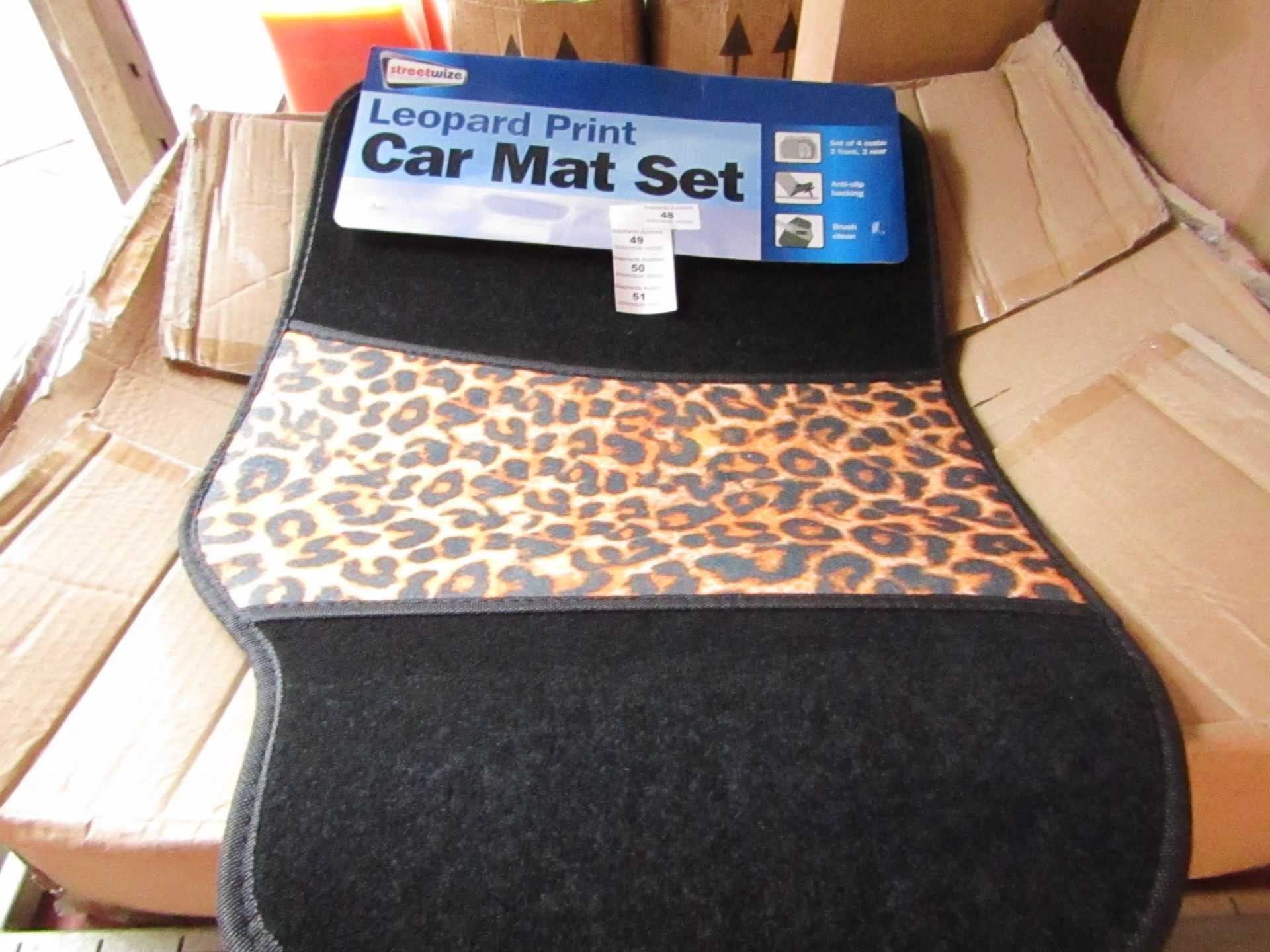 Set of 4 leopard print car mats, new and packaged.