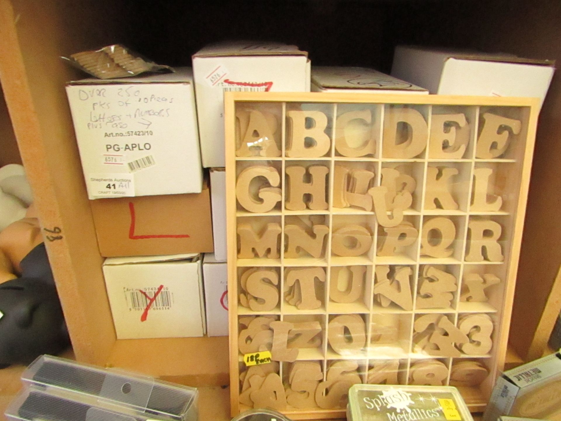 Over 250 packs of 10  per pack Wooden Letters & Numbers with Display Case & Contents