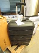 American Tourister large suitcase.