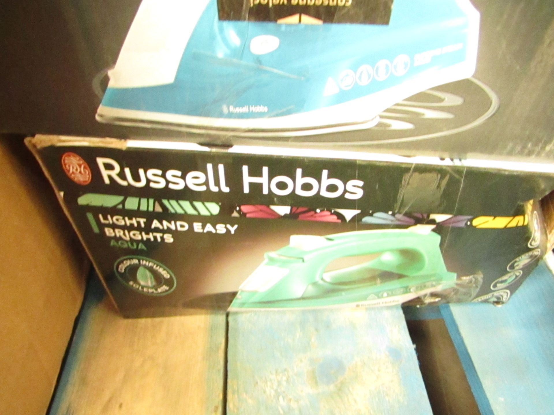 Russell Hobbs Light and Easy Brights steam iron in Aqua, unchecked and boxed.