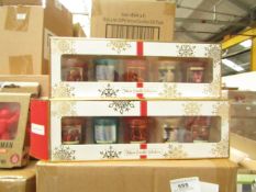 Pack of 5x festive candles, new and boxed.