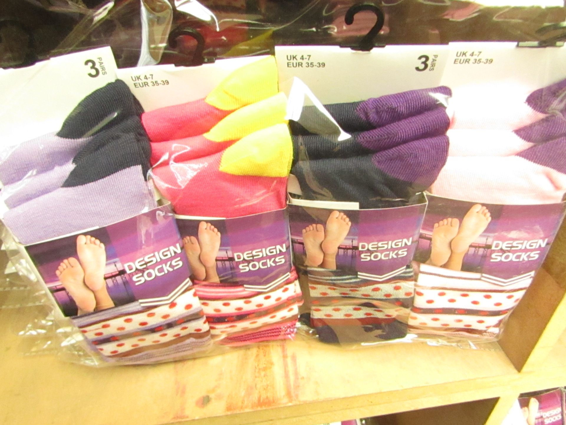 12 X Pairs of Ladies Design Socks size 4-7 new in packaging (see image for design)