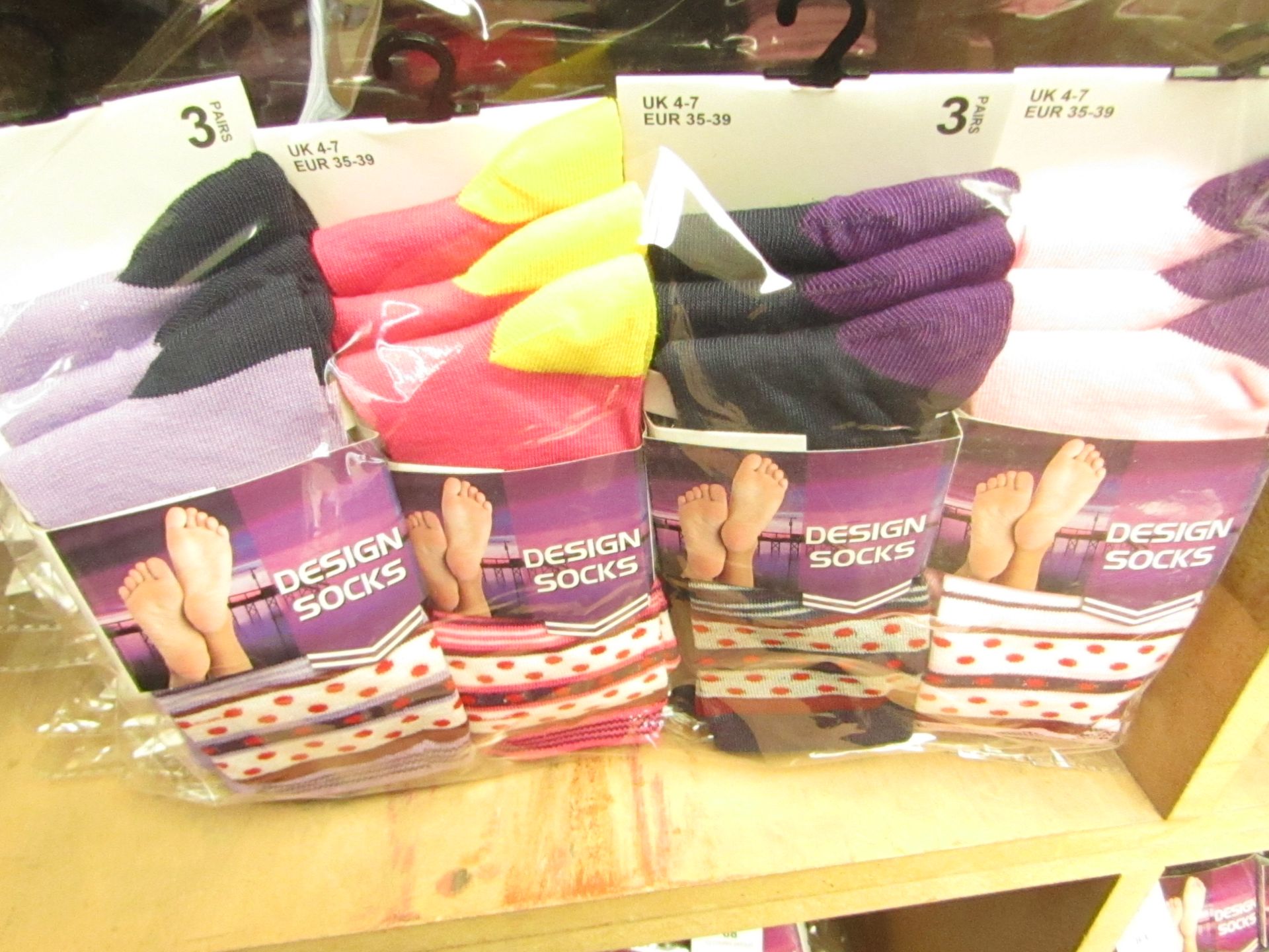 12 X Pairs of Ladies Design Socks size 4-7 new in packaging (see image for design)