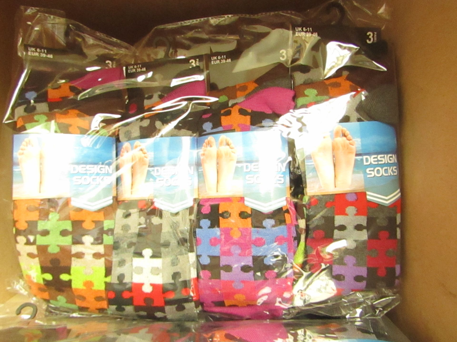 12 X Pairs of Mens Design Socks size 6-11 new in packaging (see image for design)