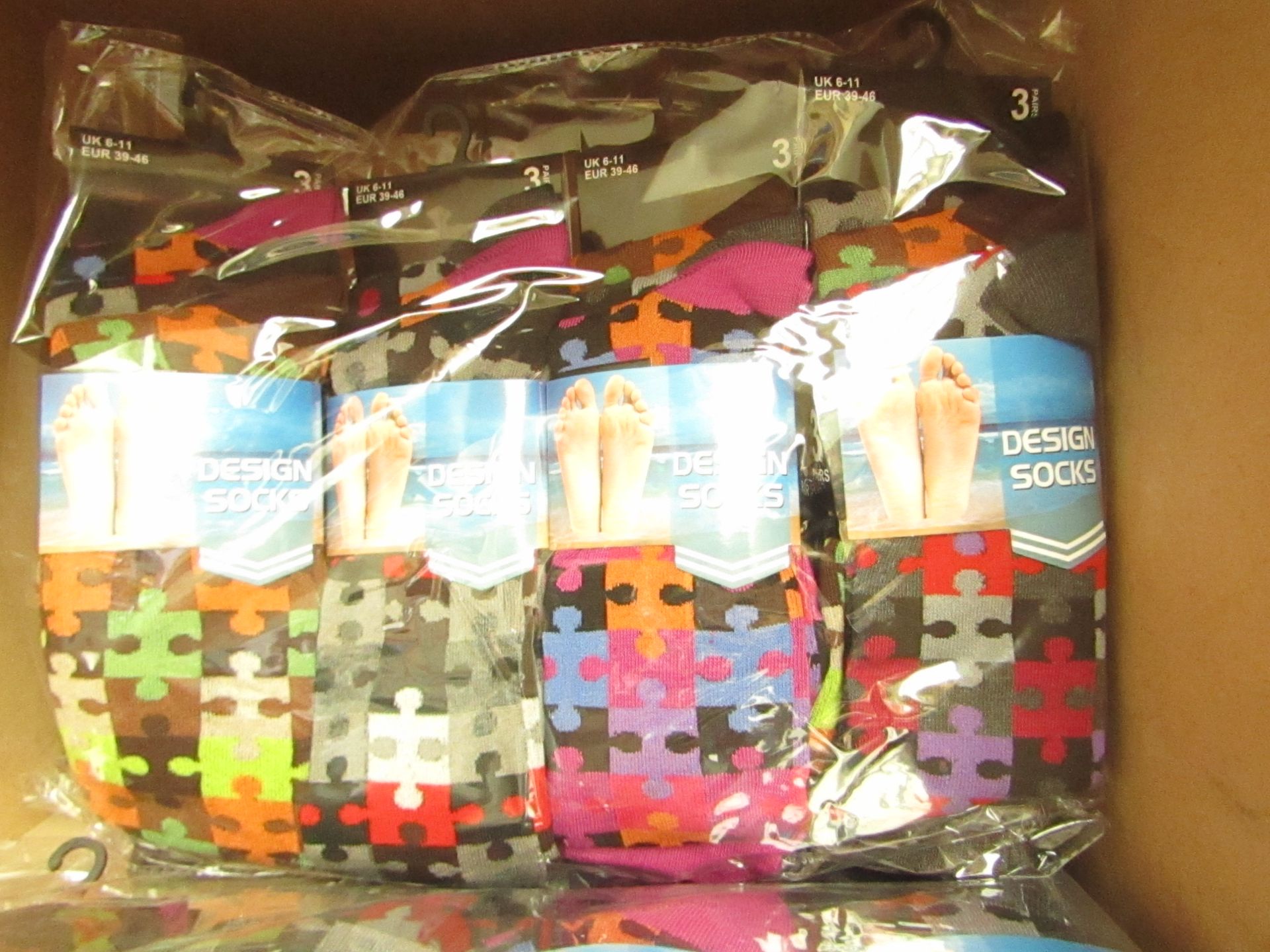 12 X Pairs of Mens Design Socks size 6-11 new in packaging (see image for design)