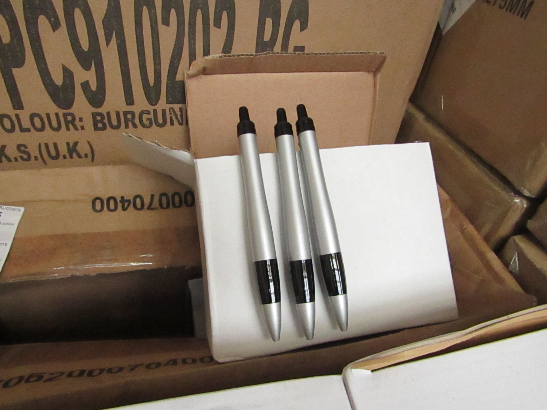 Box of 50x black ink ball point pens, new and boxed. See picture for design