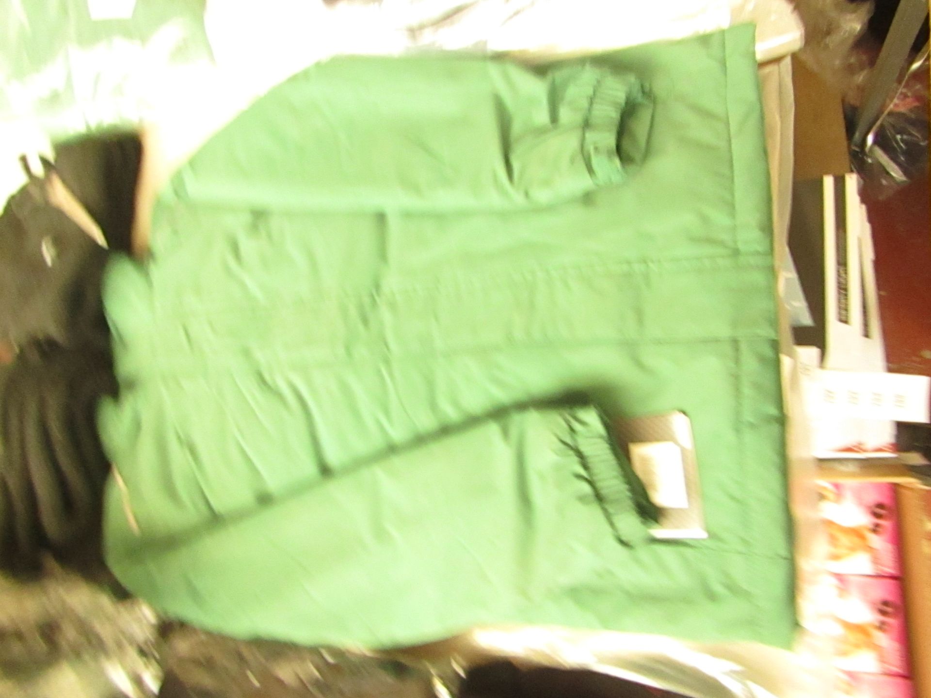 Regatta green jacket, size 9-10 yrs, new and packaged.