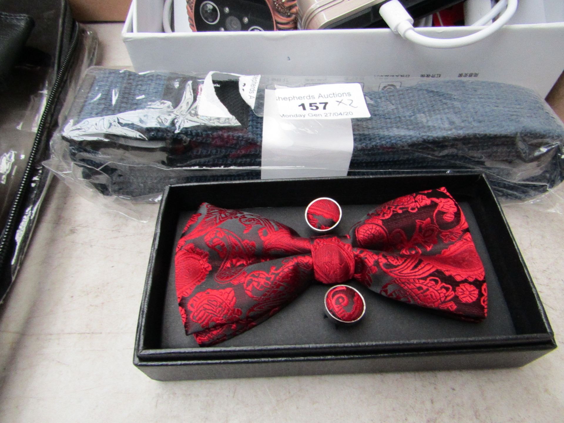 2x Items being a Bowtie, hankerchief andf cufflink set and a Yogastudios blue strap.