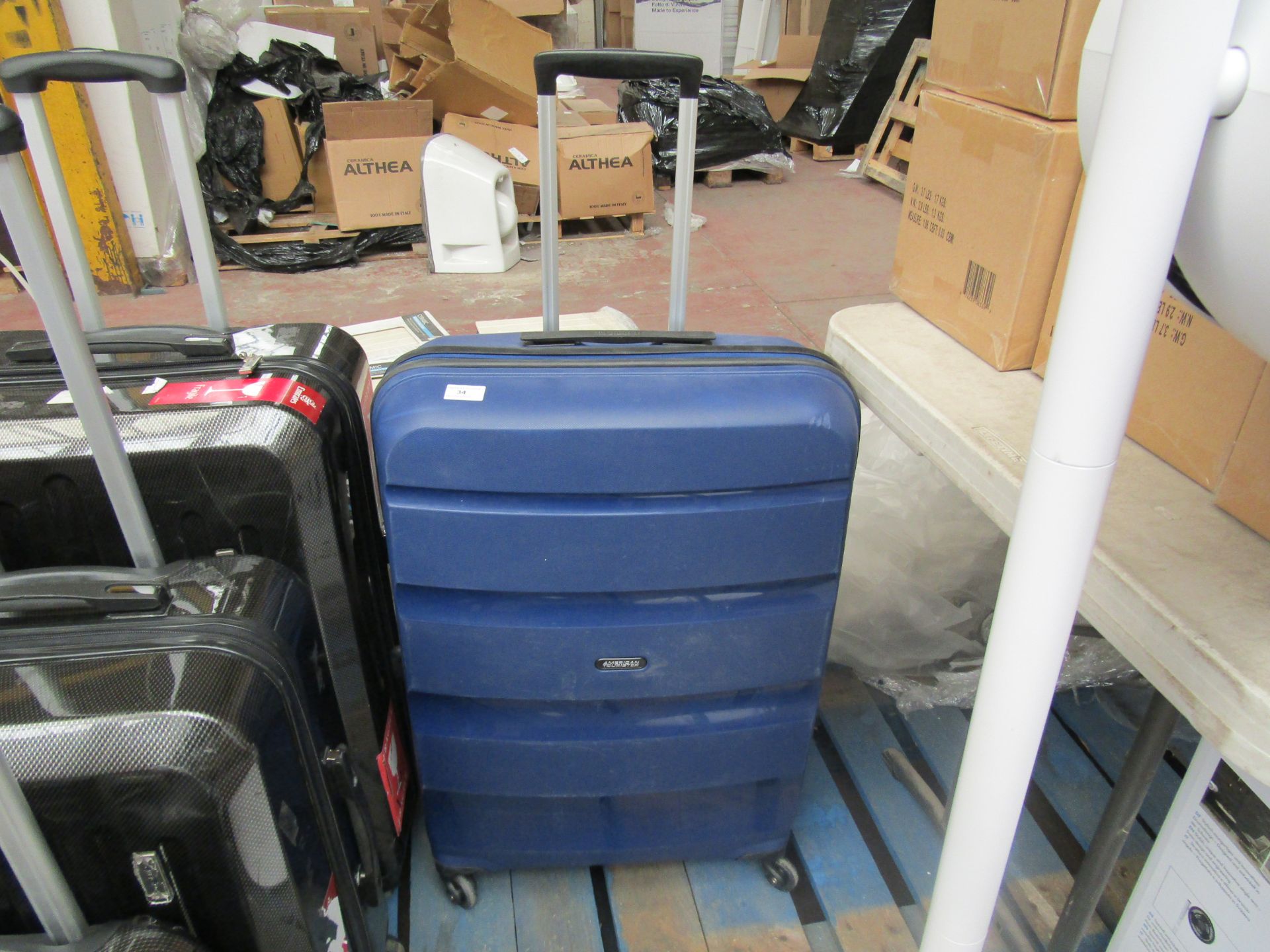 Large Blue American Tourister Suitcase. Has a few scuffs But Nothing Major