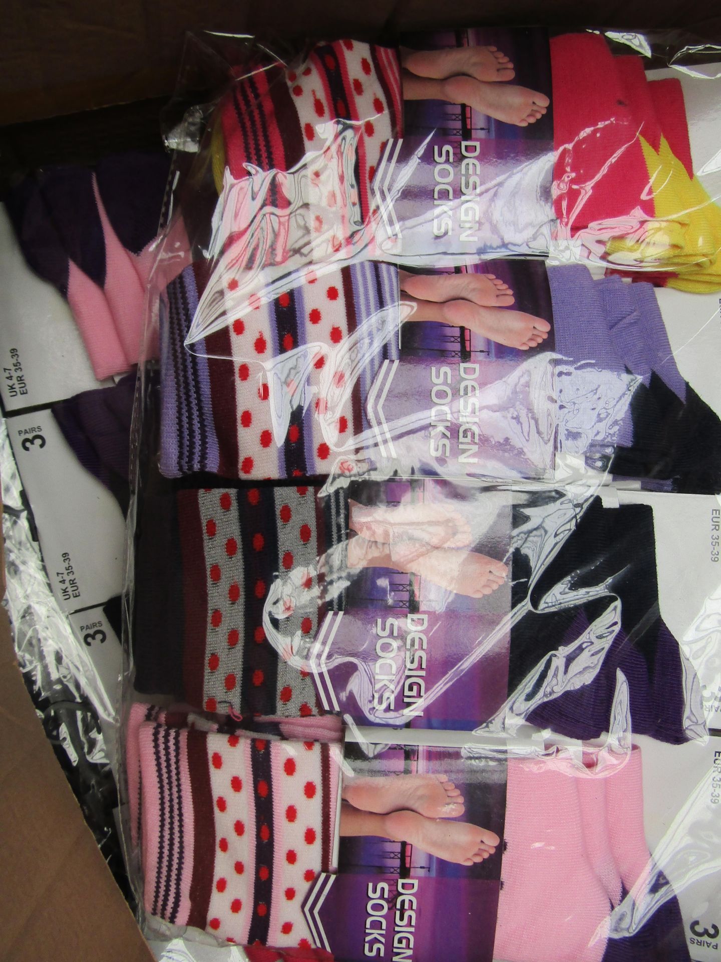 Pack of 12 Ladies Design Socks. Size 4-7. New & packaged