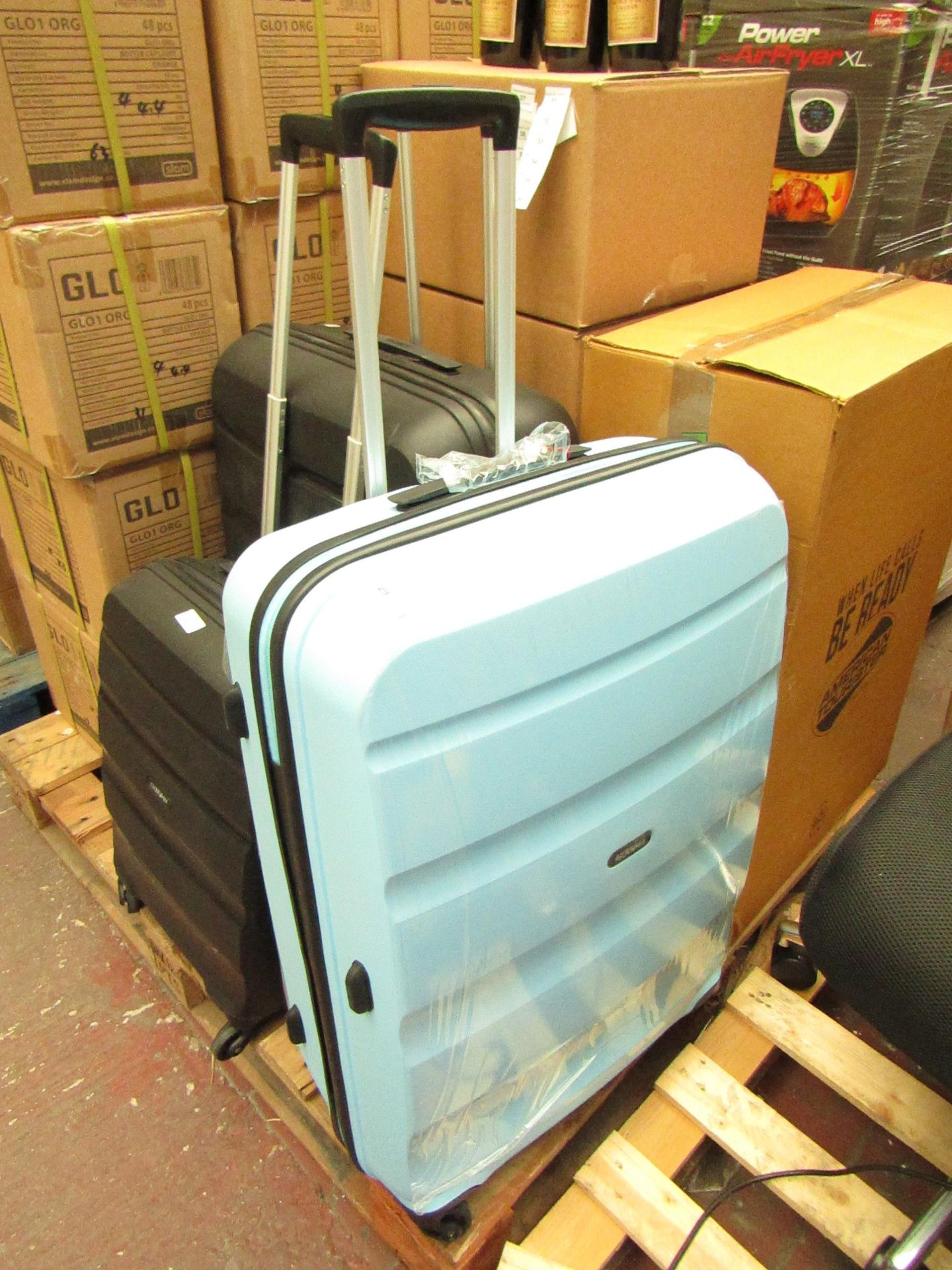 American Tourister large suitcase, no major damage.