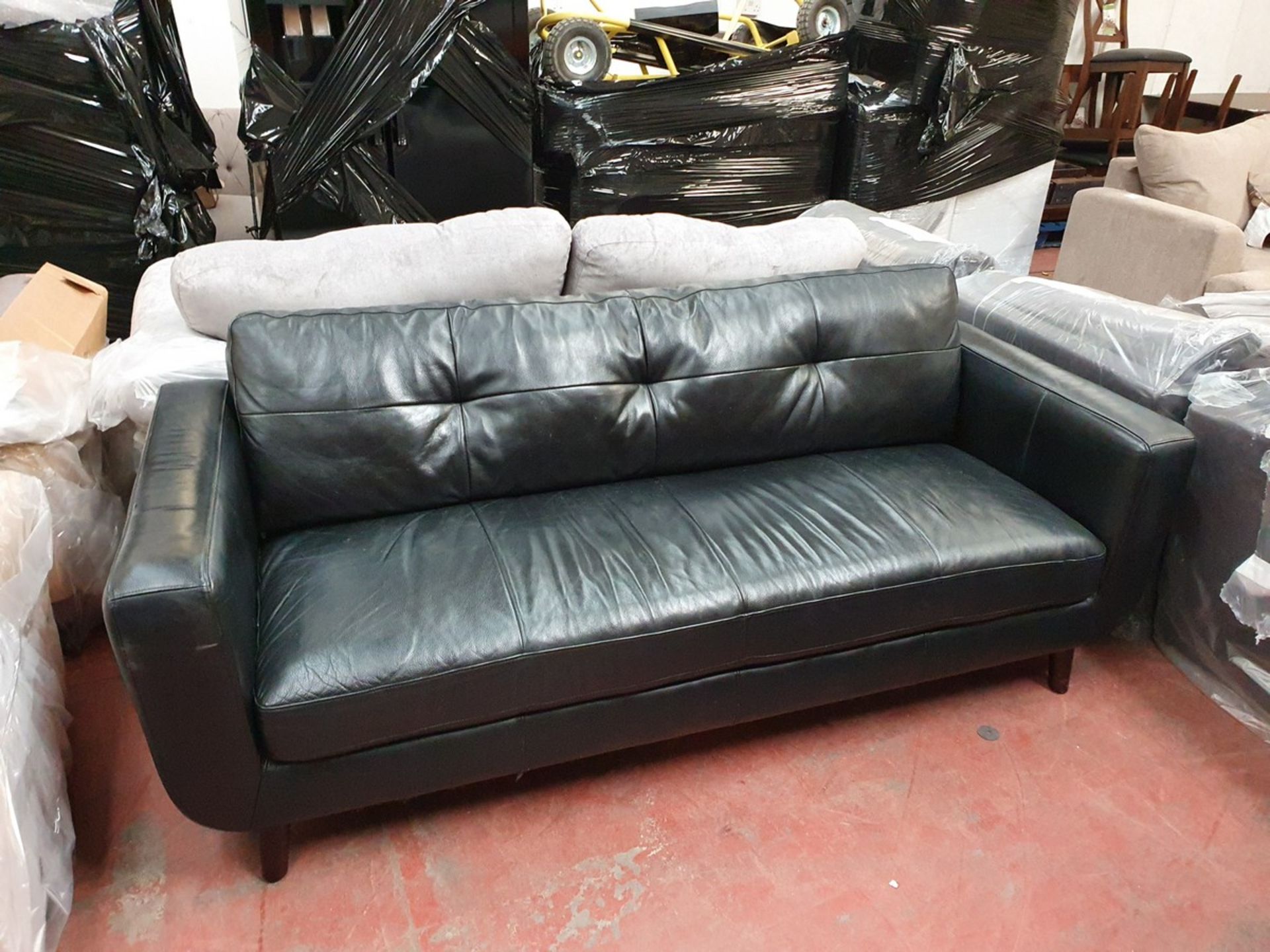 Lounge set of a 3 Seater Black Leather sofa with matching Arm chair, used with a few scratches and