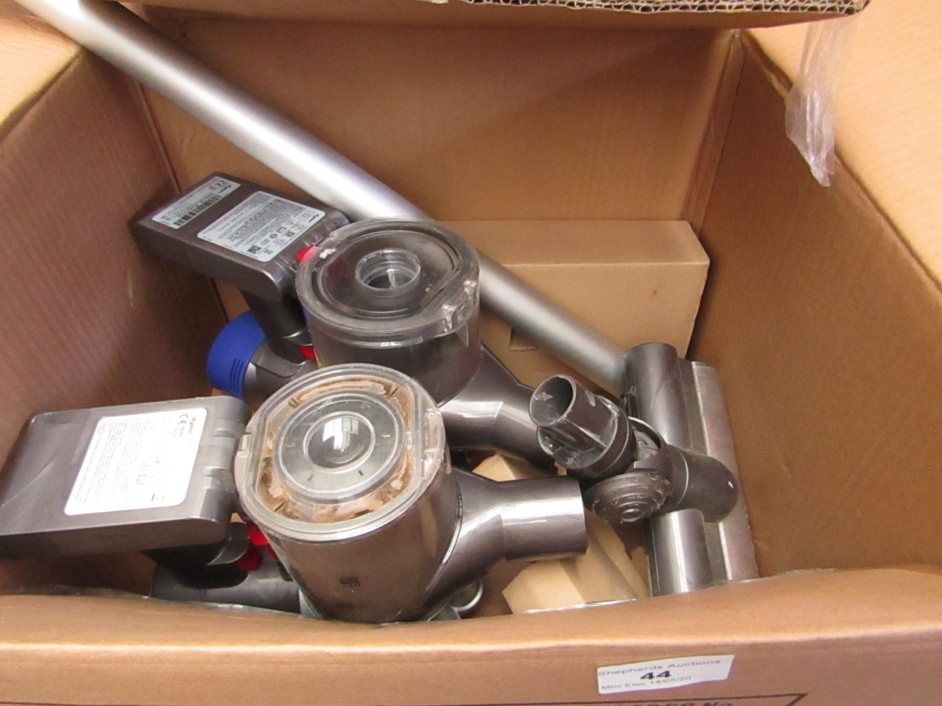 2x Dyson Hand held vacuum main body units and 2 other pieces such as a tube and a floor brush