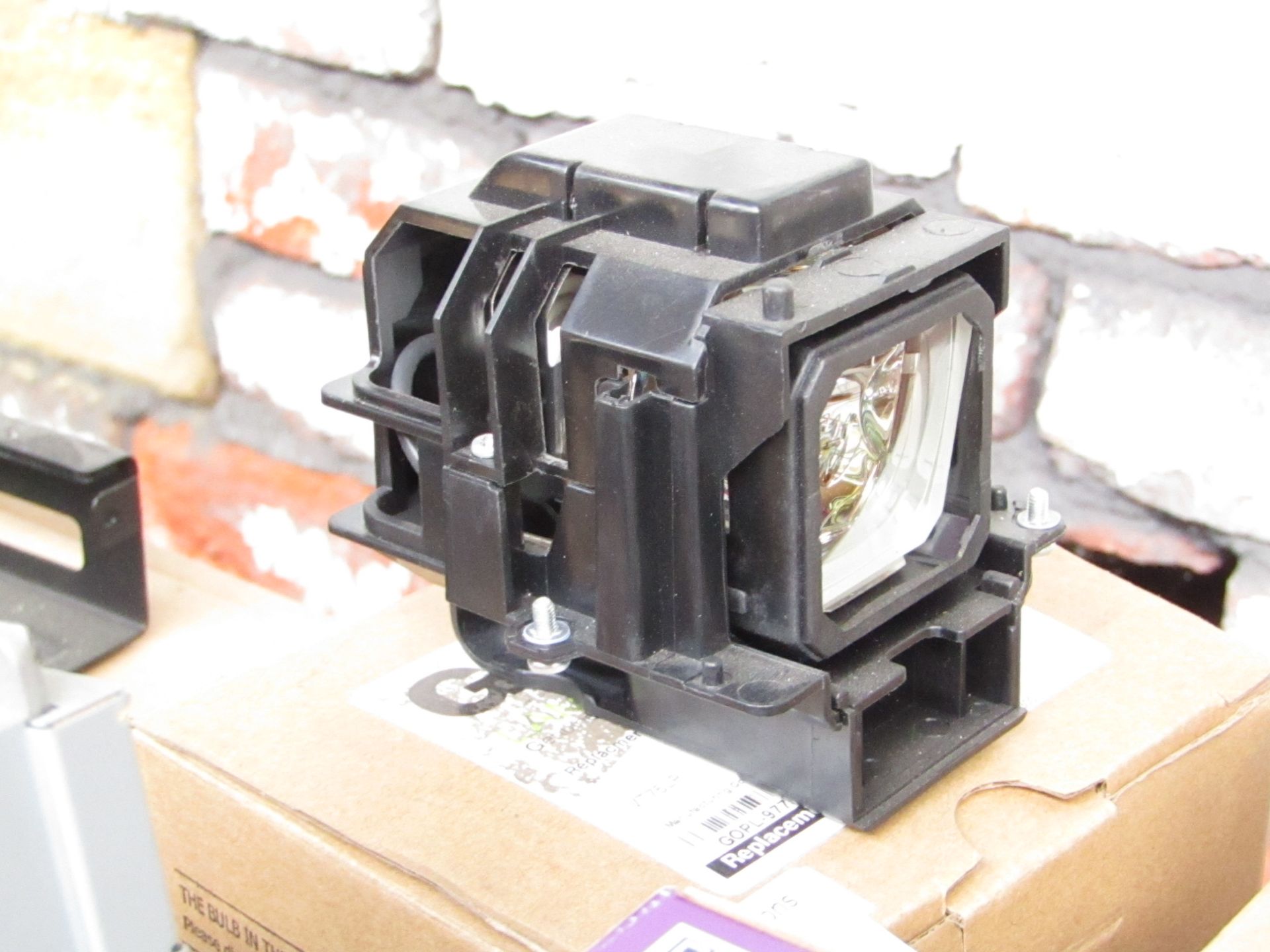 Head lamp unit, untested and boxed.