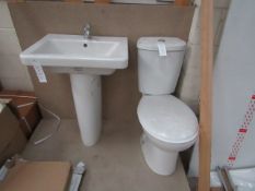 Cloak room toilet set that includes a unbranded Roca close coupled toilet complete with seat and