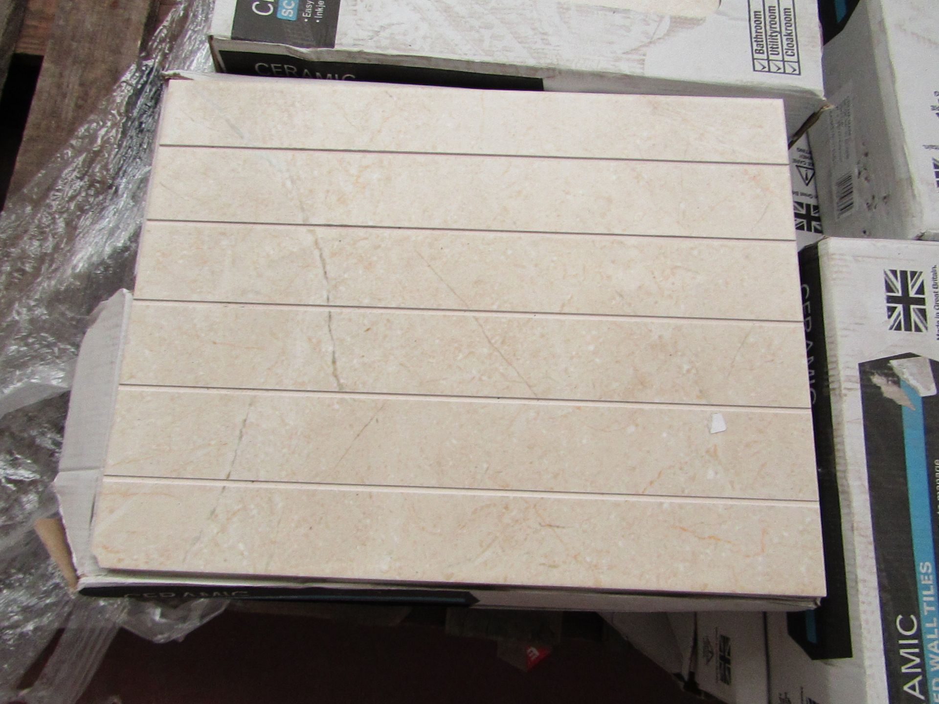 12x Packs of 10 Wickes 360x275 Crema Marfil Satin Scored wall tiles, new. Each pack is RRP £16.99