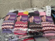 Pack of 12 Ladies Design Socks. Size 4 - 7. New & packaged