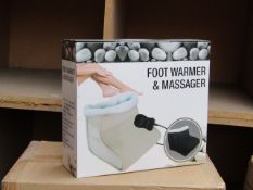 Foot warmer and massager, new and boxed.