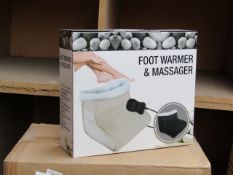 Foot warmer and massager, new and boxed.