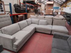 Light Grey fabric costco corner sofa and foot stool with button detail, looks in good condition,