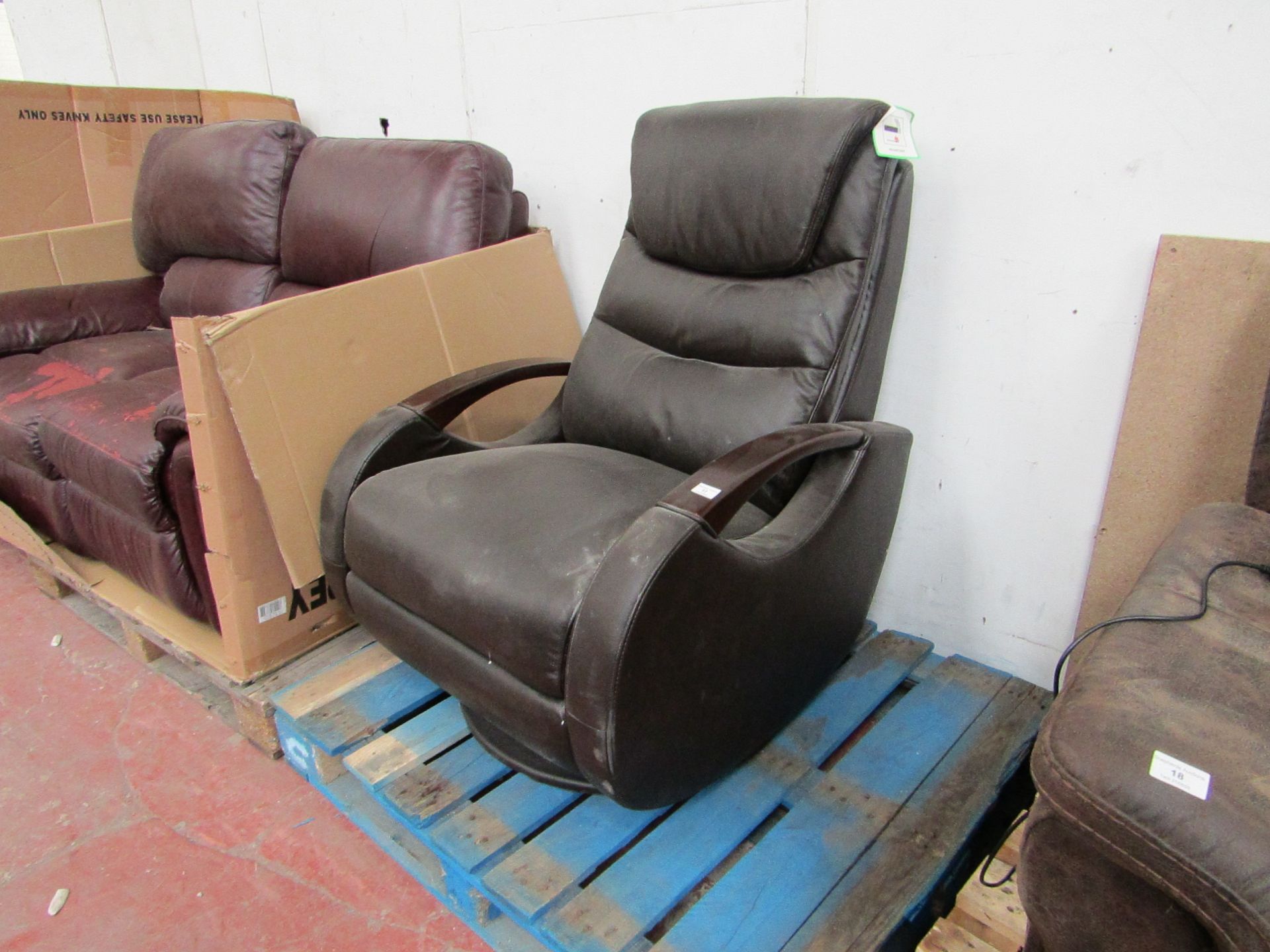 Brown Swivel reclining armchair, missing the sode manual recline arm, RRP at Costco is £349