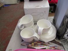 Set of 4 Small Cup & Saucers. New & boxed