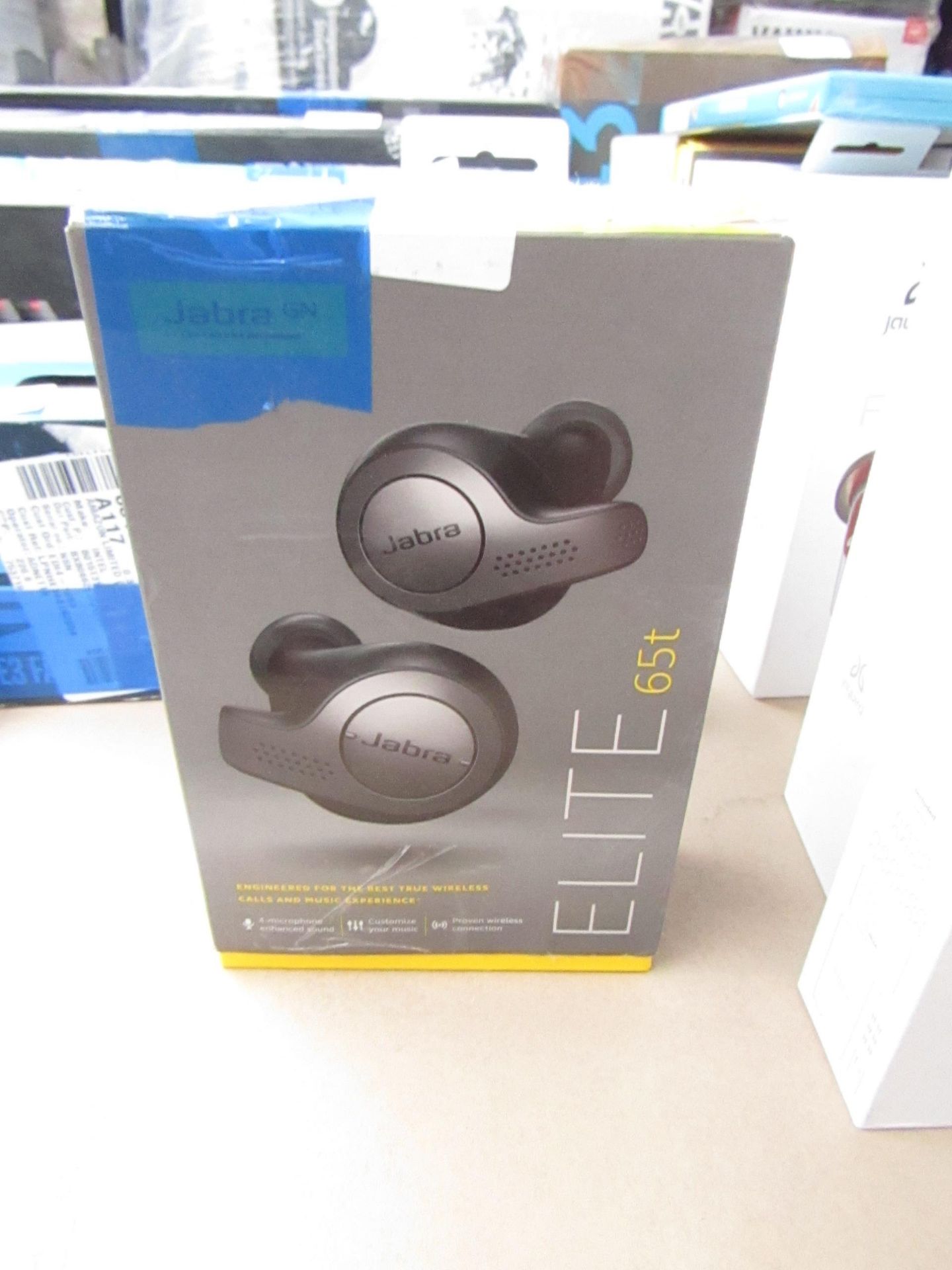 Jabra Active 65t wireless ear buds, powers on but only one ear works. Missing tips. Boxed. RRP