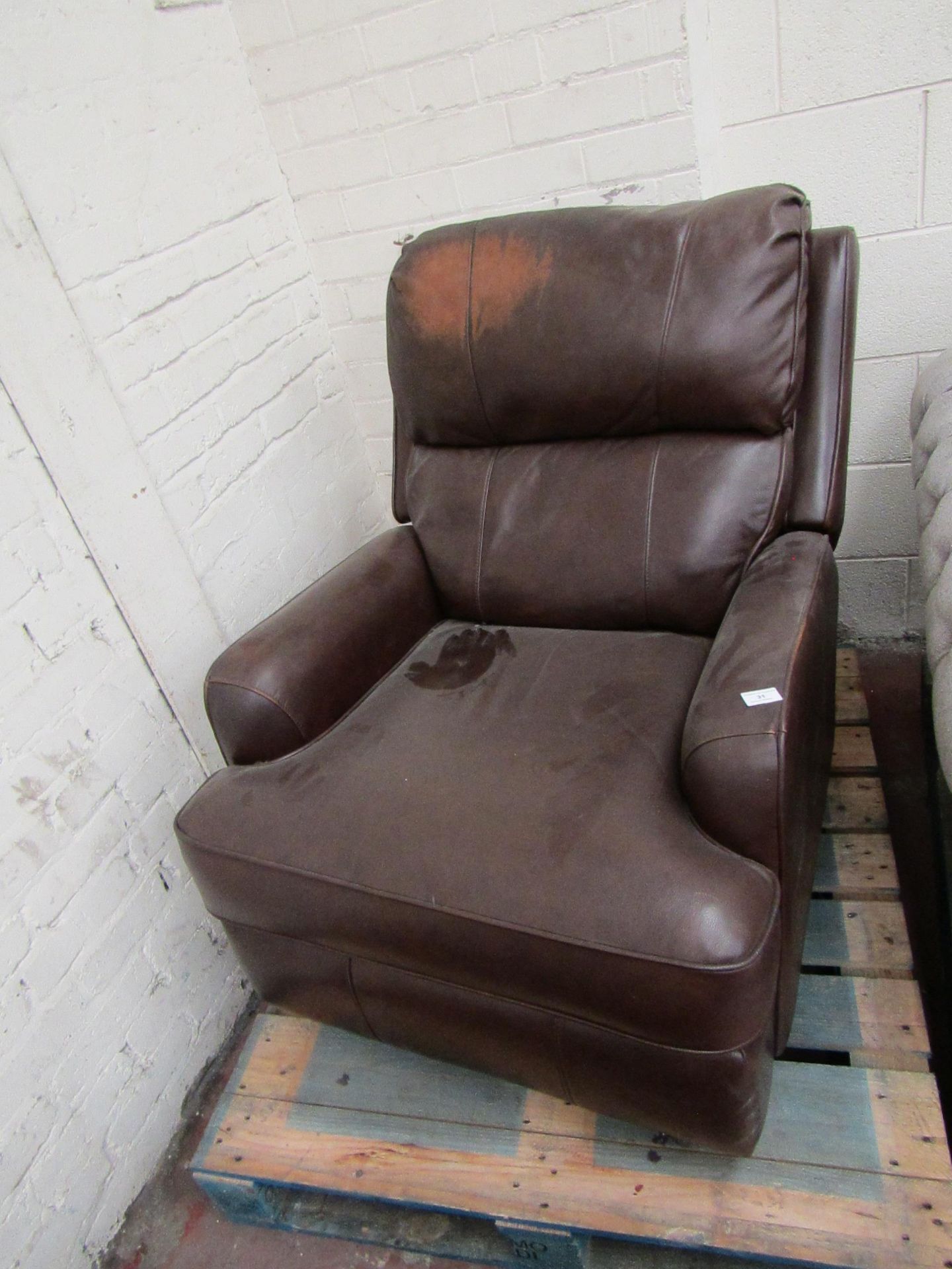 Costco Leather rockingmanual recliner leather arm chair, the mechanism is working but it needs a