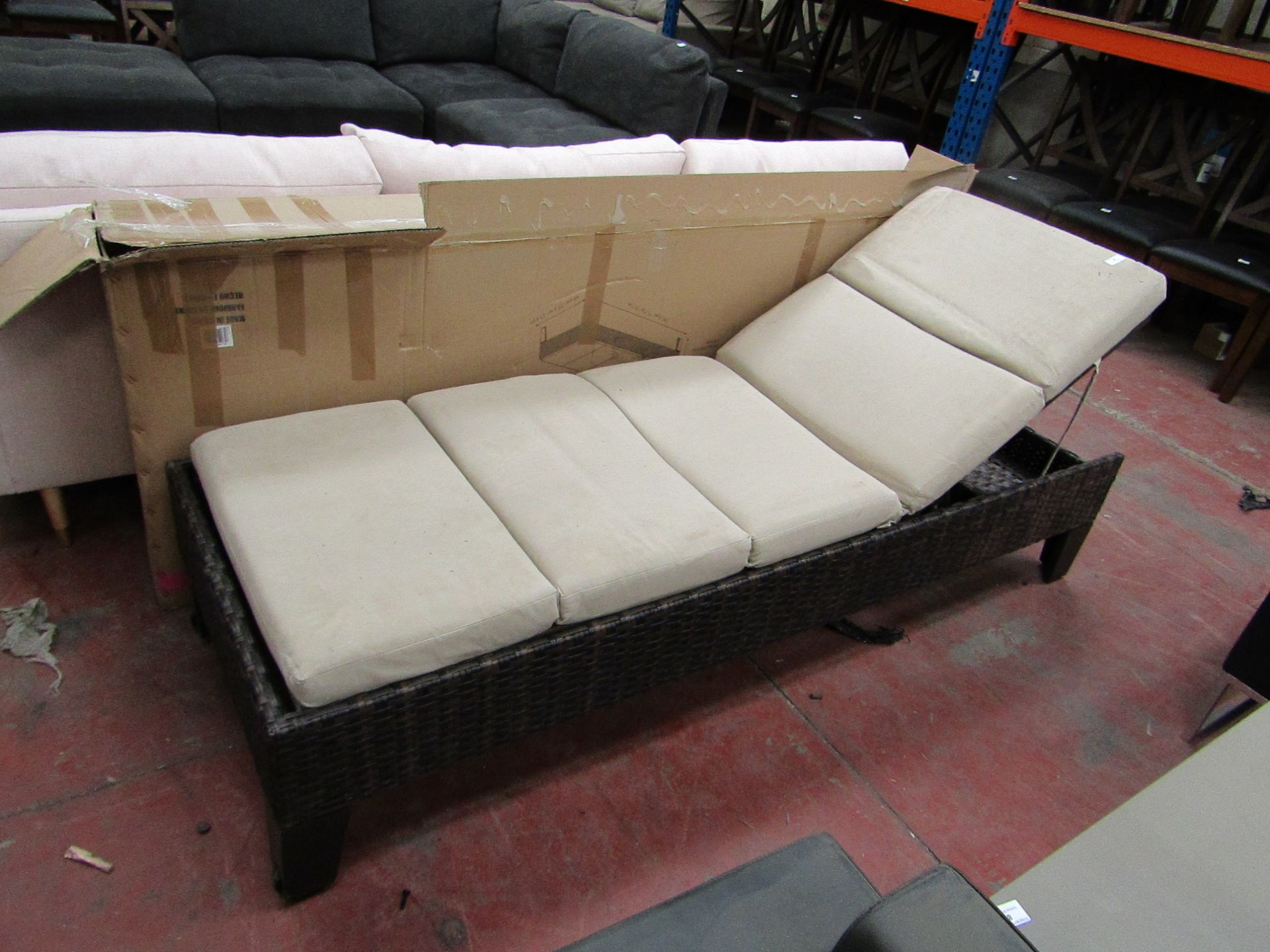 Costco rattan sun lounger with cushion and 2 roller feet, the item is used ad the cushion could do