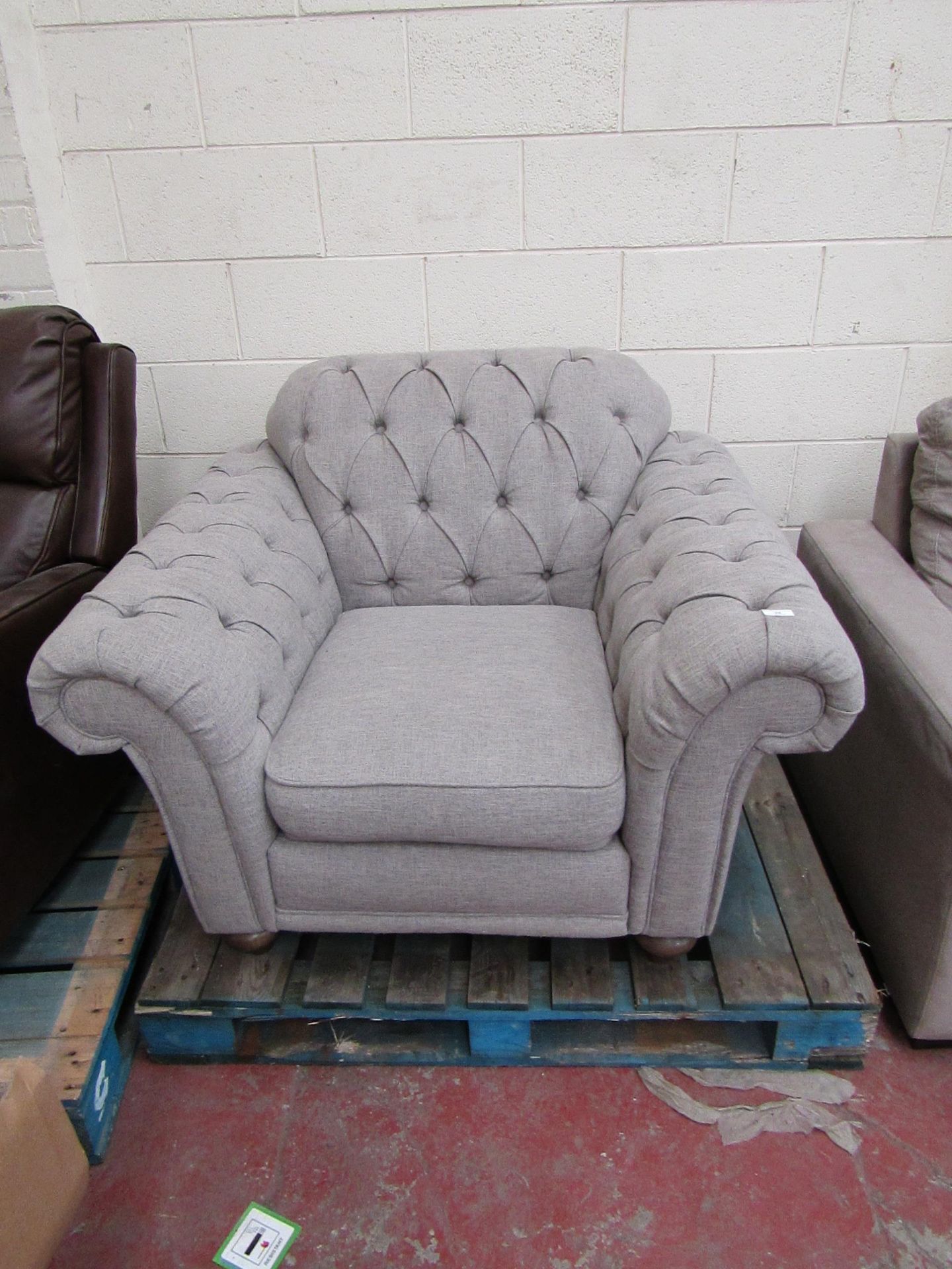 Fbric Button Back arm chair, overall in good condition, it is a bity bobbly on the arms and could do