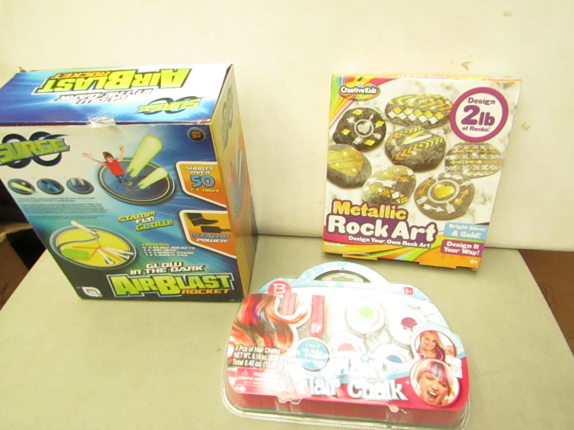3 Items Being Air Blast Rocket, Metalic art Set & Hair Flair Chalk Set.