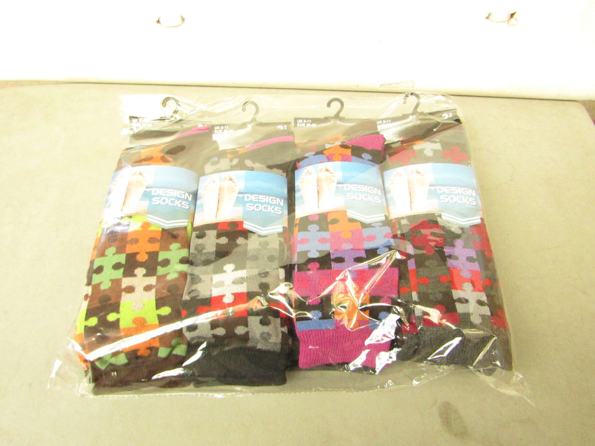 12 X Pairs of Mens Design Socks size 6-11 new in packaging (see image for design)