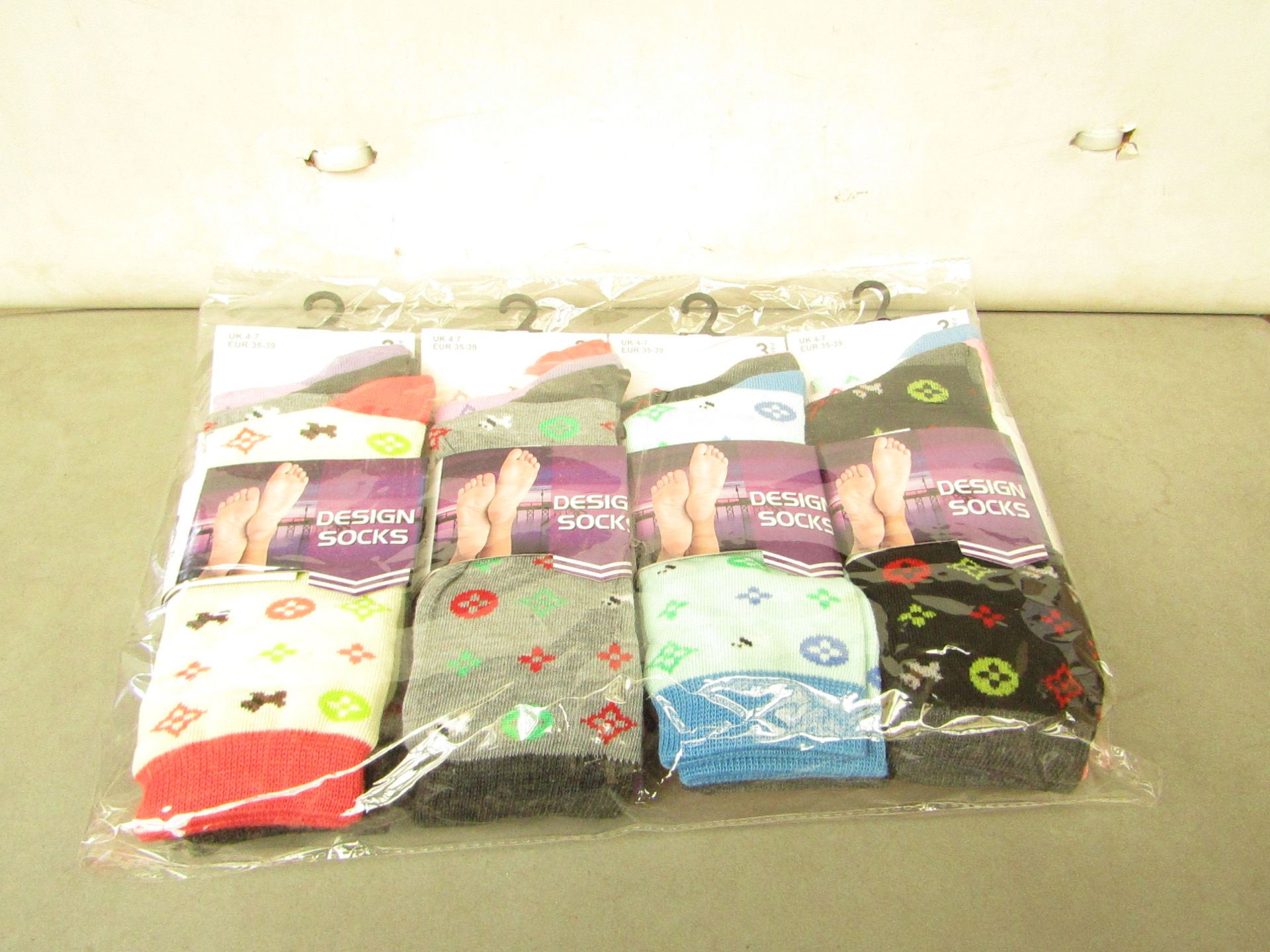 12 X Pairs of Ladies Design Socks size 4-7 new in packaging (see image for design)