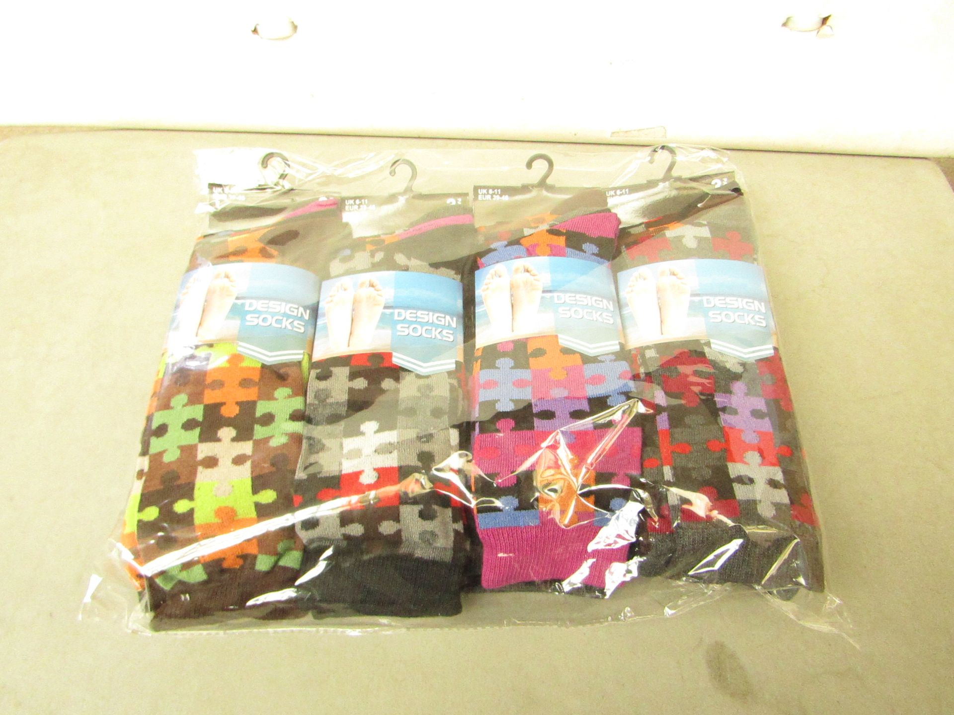 12 X Pairs of Mens Design Socks size 6-11 new in packaging (see image for design)