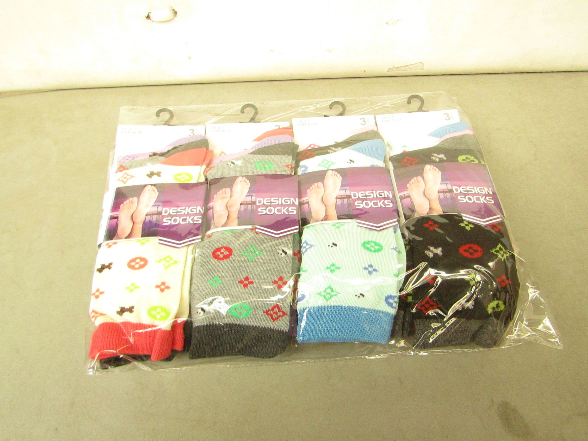 12 X Pairs of Ladies Design Socks size 4-7 new in packaging (see image for design)