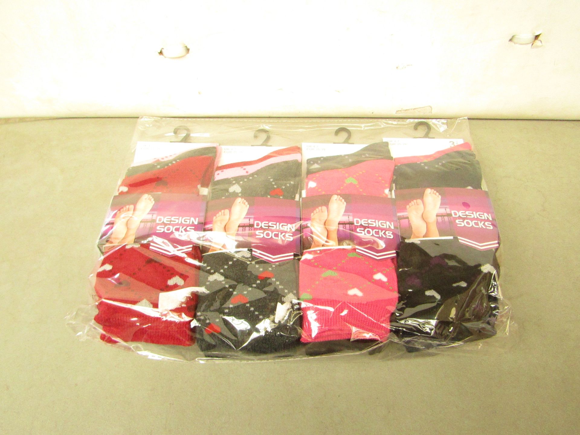 12 X Pairs of Ladies Design Socks size 4-7 new in packaging (see image for design)