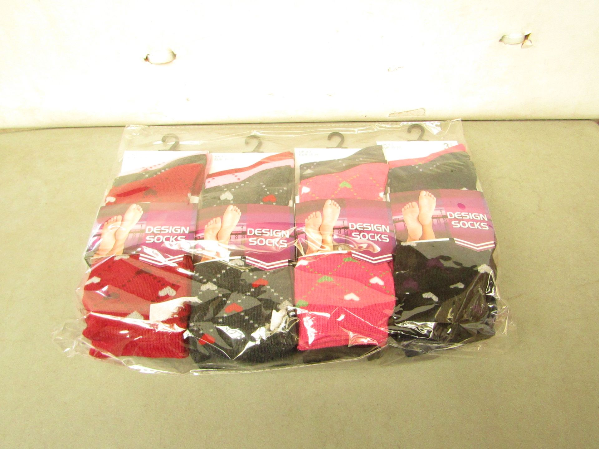 12 X Pairs of Ladies Design Socks size 4-7 new in packaging (see image for design)