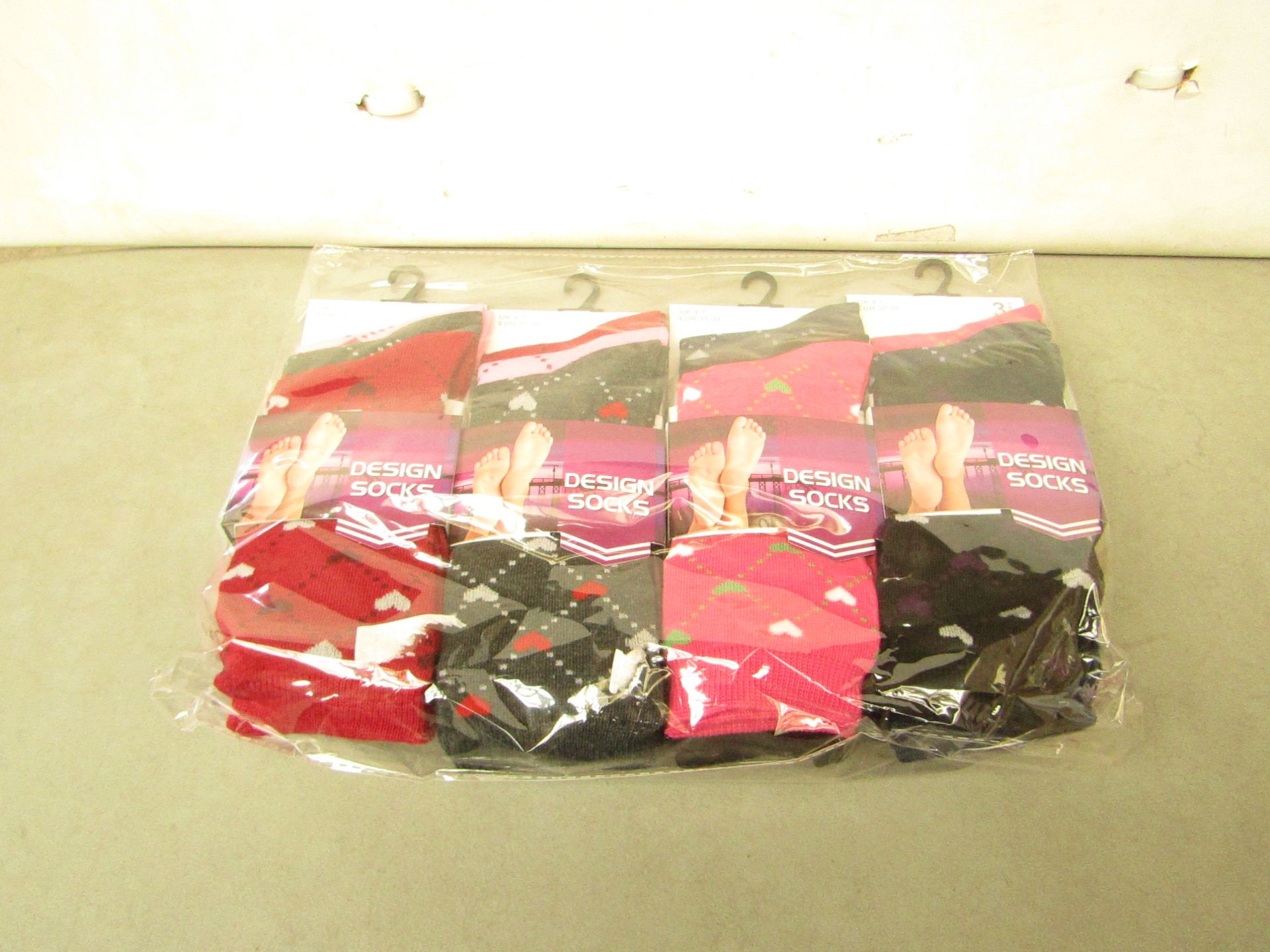 12 X Pairs of Ladies Design Socks size 4-7 new in packaging (see image for design)