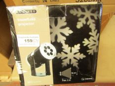 Lumineo Snowflake Projector. Indoor only. Boxed but unchecked