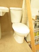 Cloak room toilet set that includes an unbranded Roca close coupled toilet complete with seat and