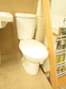 Cloak room toilet set that includes an unbranded Roca close coupled toilet complete with seat and