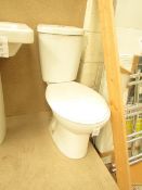 Cloak room toilet set that includes an unbranded Roca close coupled toilet complete with seat and